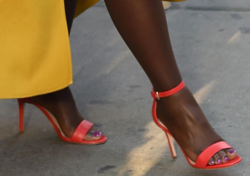 Lupita Nyong'o, red leather sandals