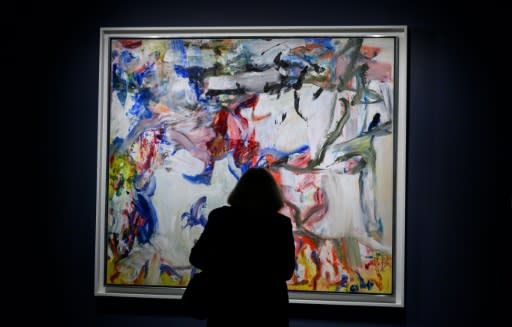 A journalist views Willem de Kooning's "Untitled XXII" during an auction preview November 1, 2019 at Sotheby's in New York