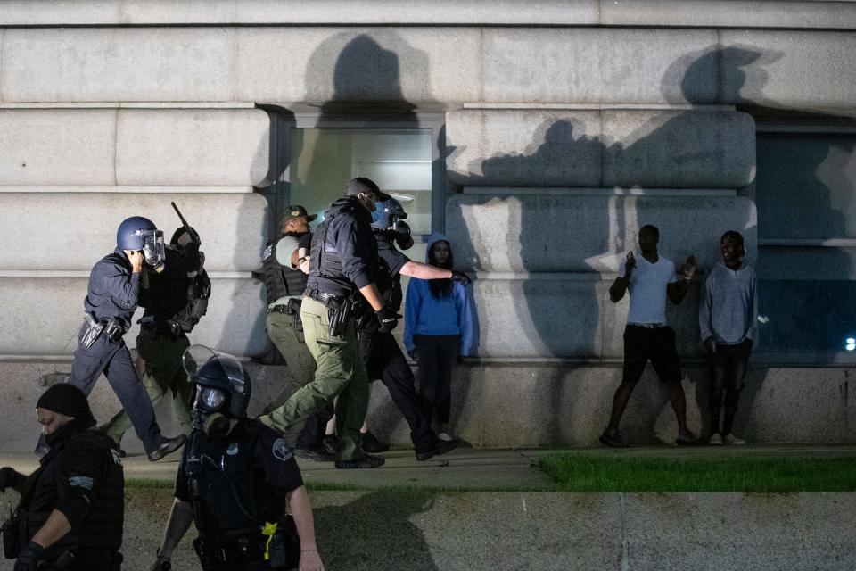 A protester is being arrested by the Detroit police officers after an afternoon march and rally against police brutality extended into the evening and became contentious on Friday, May 29, 2020 in Detroit.