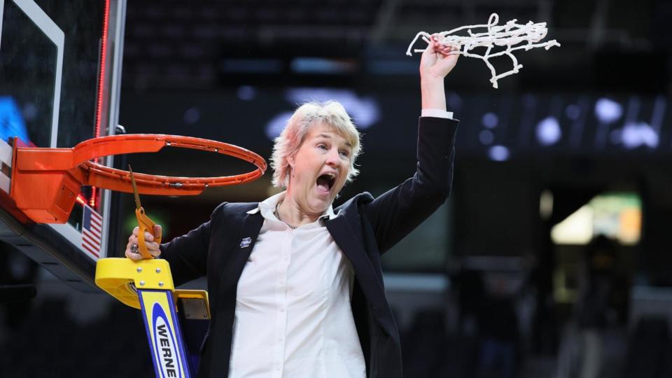 PHOTO: Head coach Lisa Bluder of the Iowa Hawkeyes celebrates as she cuts down the net after beating the LSU Tigers in the Elite 8 round of the NCAA Women's Basketball Tournament at MVP Arena, April 1, 2024, in Albany, New York.  (Andy Lyons/Getty Images)
