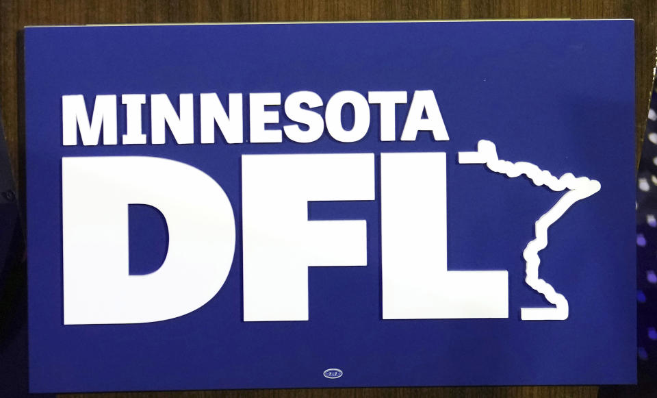 FILE - The Minnesota DFL logo appears on a podium at a DFL election-night party, Nov. 8, 2022, in St. Paul, Minn. On Saturday, May 14, 2023, a brawl broke out over nominations for Minneapolis City Council candidates Aisha Chughtai and Nasri Warsame, leaving at least two people injured, the Star Tribune reported. (AP Photo/Abbie Parr, file)