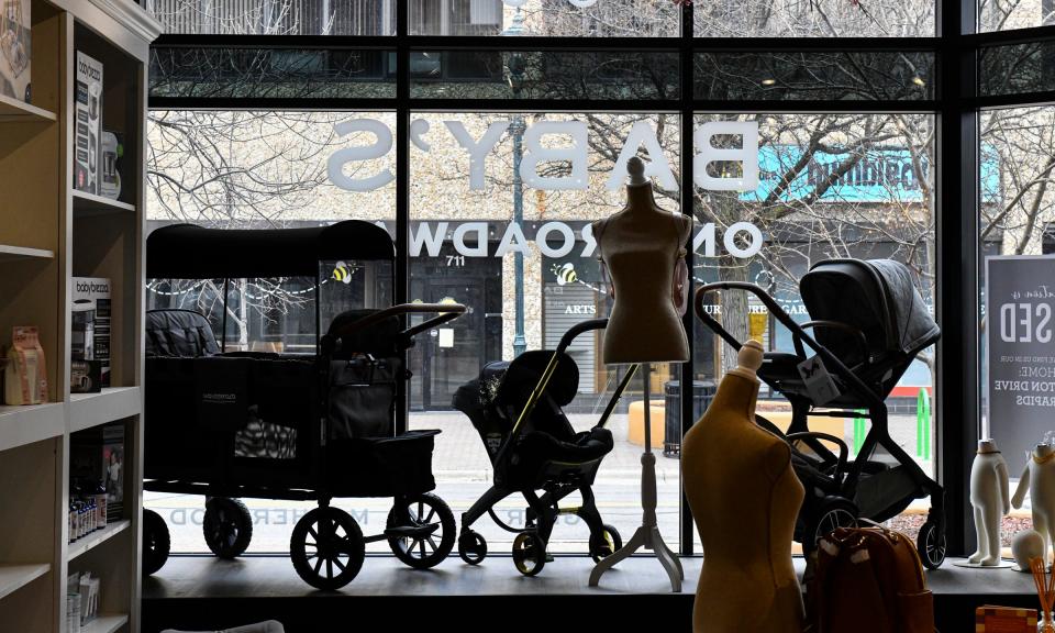Items are placed in the window overlooking St. Germain Street Tuesday, April 26, 2022, at Baby's on Broadway in downtown St. Cloud.