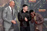 <p>Has anyone ever had more fun on a press tour than these guys? The stylish trio could barely keep it together on the red carpet, as they arrived for the German premiere of <em>Jumanji</em> on Wednesday in Berlin. (Photo: Matthias Nareyek/Getty Images for Sony Pictures) </p>