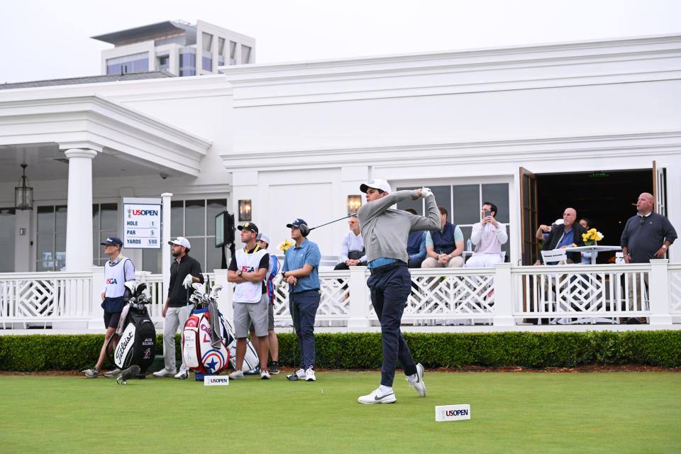 Amateur Omar Morales hits the opening shot off the first tee at the 123rd U.S. Open Championship.