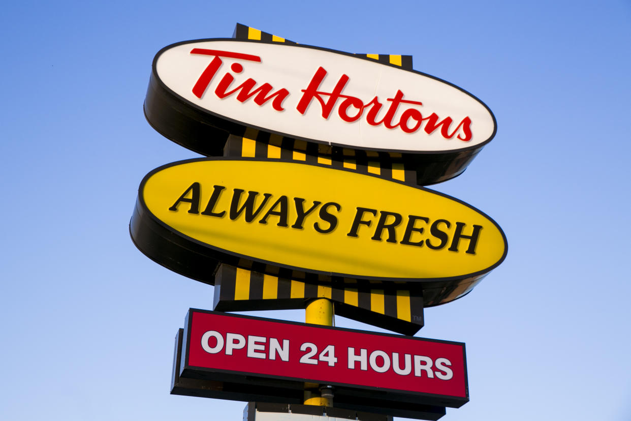 A logo sign outside of a Tim Hortons restaurant in Oakville, ON, Canada on April 14, 2017. Photo by Kristoffer Tripplaar *** Please Use Credit from Credit Field ***