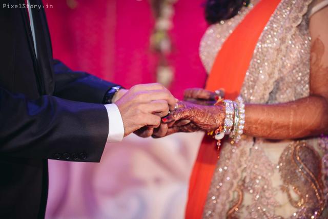 indian punjabi wedding couple holding hands