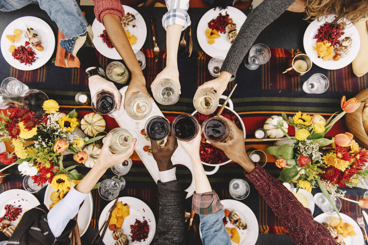 Cheers to making this the best Friendsgiving yet. (Photo: Getty Images)