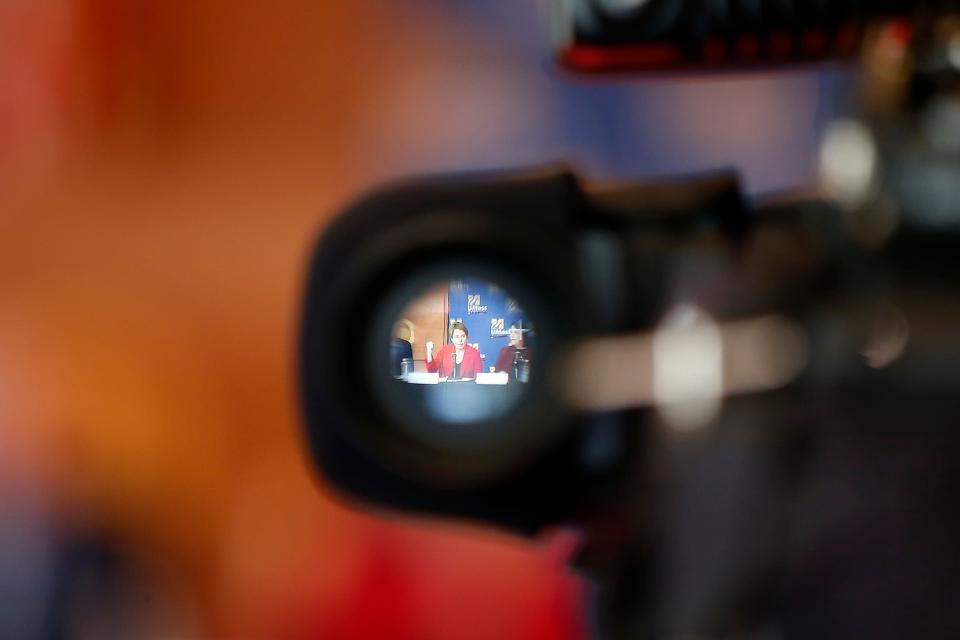 Massachusetts Governor Maura T. Healey is seen inside the viewfinder of a TV camera during her visit to UMass Dartmouth to learn more about the school's work around climate sustainability goals.