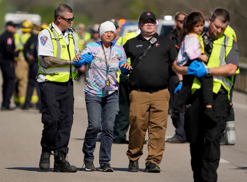 People are transported from a fatal school bus crash in Austin