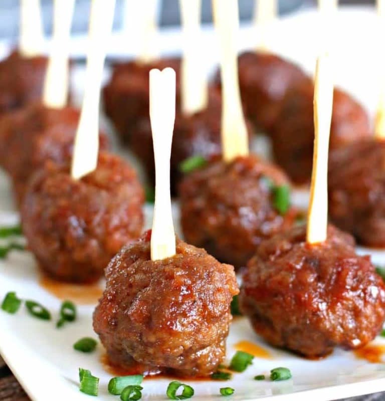 <p>The Country Cook</p><p>Homemade meatballs in a sweet and spicy sauce.</p><p><strong>Get the recipe: <a href="https://www.thecountrycook.net/crock-pot-ultimate-party-meatballs/" rel="nofollow noopener" target="_blank" data-ylk="slk:Crock Pot Party Meatballs;elm:context_link;itc:0;sec:content-canvas" class="link rapid-noclick-resp">Crock Pot Party Meatballs</a></strong></p>