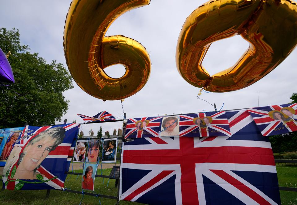 Tributes placed by Royal fans outside Kensington Palace in London, Thursday, July 1, 2021, to mark what would have been Princess Diana's 60th birthday. Princes William and Harry are due on Thursday to unveil a statue of their mother, Princess Diana, on what would have been her 60th birthday.