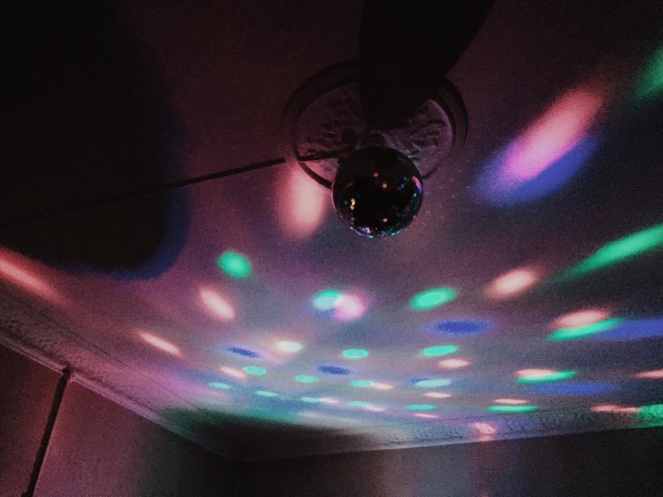 Low Angle View Of Disco Ball Hanging In Illuminated Room