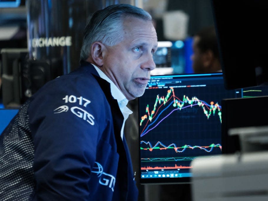 Traders work on the floor of the New York Stock Exchange