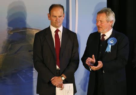 United Kingdom Independence Party (UKIP) candidate Douglas Carswell (L) reacts next to the Conservative Party candidate Giles Watling after winning the by-election in Clacton-on-Sea in eastern England October 10, 2014. REUTERS/Stefan Wermuth