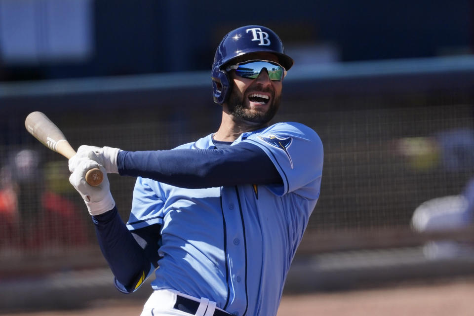 Tampa Bay Rays center fielder Kevin Kiermaier (39) reacts after fouling a ball off his foot during the sixth inning of a spring training baseball game Saturday, March 13, 2021, in Port Charlotte, Fla.. (AP Photo/John Bazemore)