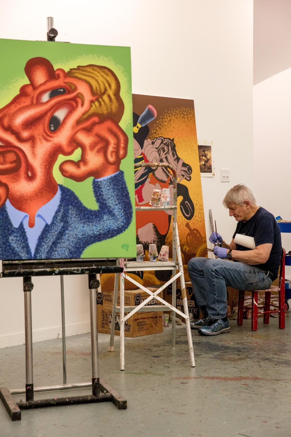 Peter Saul at work in his studio in Germantown, New York.