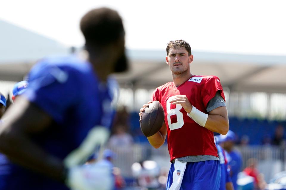 New York Giants quarterback Daniel Jones (8) looks to throw to wide receiver Parris Campbell, left, during training camp in East Rutherford on Monday, July 31, 2023.