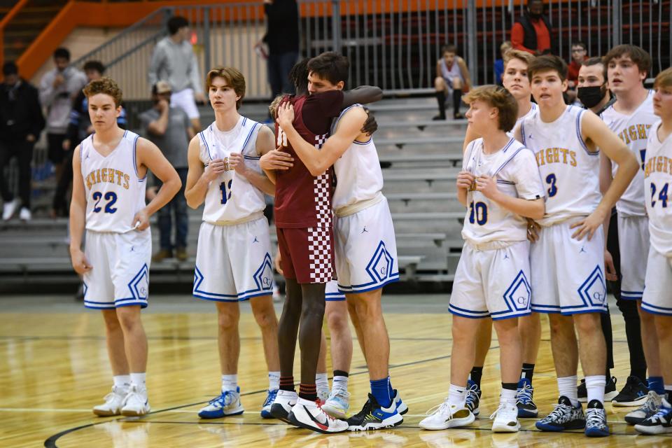 Roosevelt's Koor Kuol hugs O'Gorman's Joe Lynch after Roosevelt beat O'Gorman in the class AA state boys basketball championship on Saturday, March 20, 2021 at the Rushmore Plaza Civic Center in Rapid City.