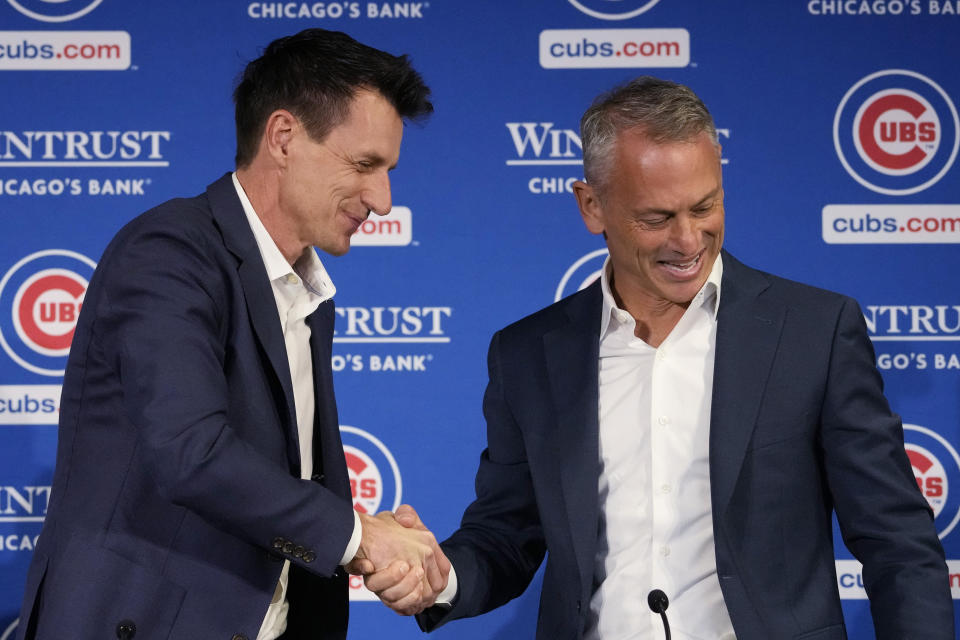 Chicago Cubs president of baseball operations Jed Hoyer, right, shakes hands with new manager Craig Counsell during an introductory press conference in Chicago, Monday, Nov. 13, 2023. (AP Photo/Nam Y. Huh)