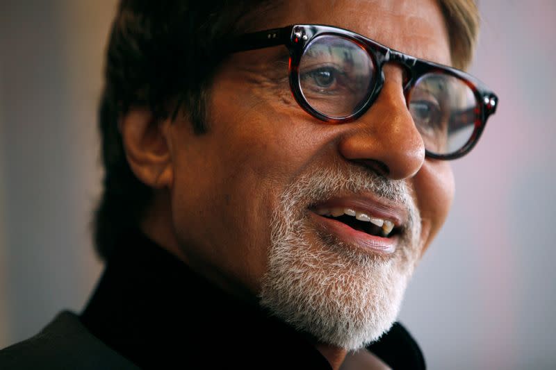 FILE PHOTO: Indian actor Amitabh Bachchan reacts during the Asian Film Awards news conference in Hong Kong