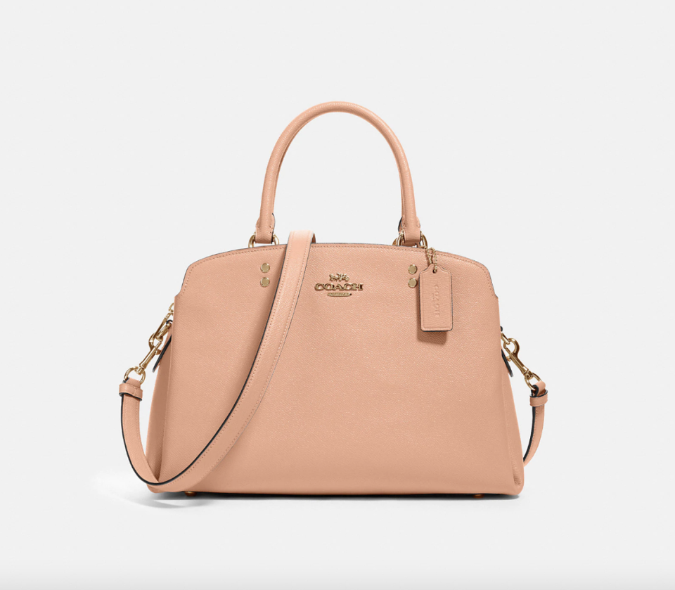 Coach Outlet Lillie Carryall in Gold/Faded Blush (Photo via Coach Outlet)