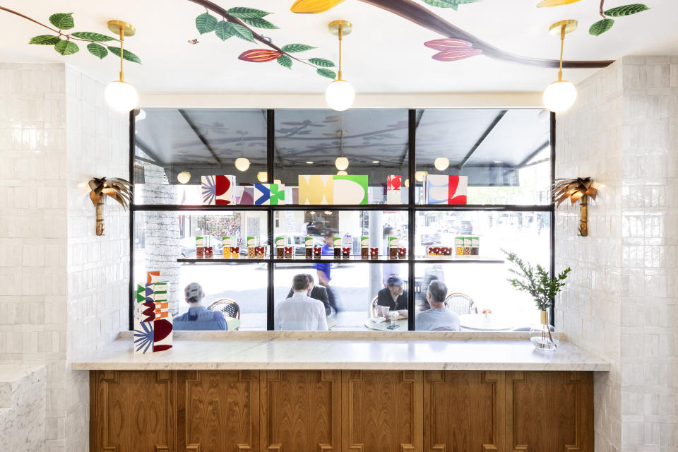 This 2019 photo shows the inside of andSons Chocolatiers in Beverly Hills, Calif., which was designed by Lauren Buxbaum Gordon and Nate Berkus. Homeowners seeking inspiration for a kitchen remodel can look to the countertops and cabinetry they see in public spaces such as cafes and boutiques like these shown here at andSons. (Christopher Dibble via AP)