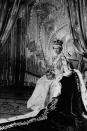 <p>Bow down to the birthday queen. Here, Elizabeth is photographed on her throne after her coronation. </p>