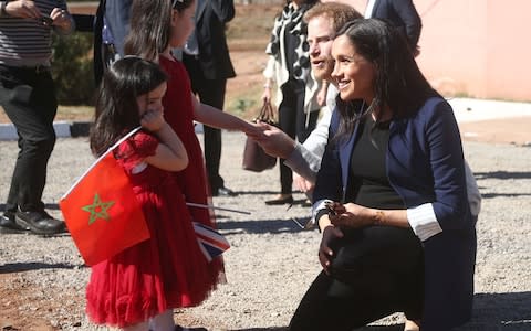 The Duke and Duchess of Sussex meet sisters Rania Minejem aged 5 and Rayhana Minejem aged 2 - Credit: PA