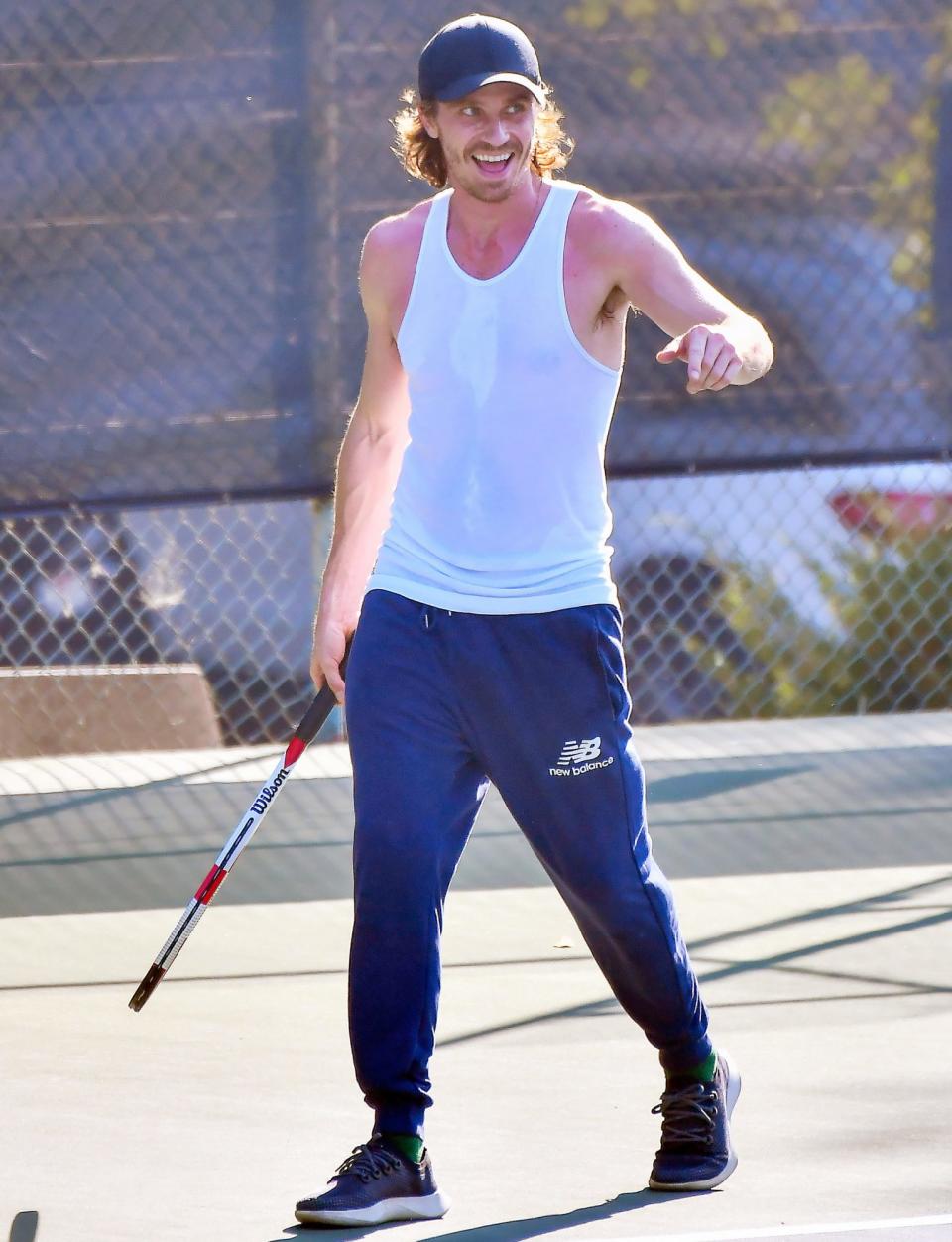 <p>Soon-to-be dad Garrett Hedlund plays tennis with a friend on Tuesday in L.A. </p>