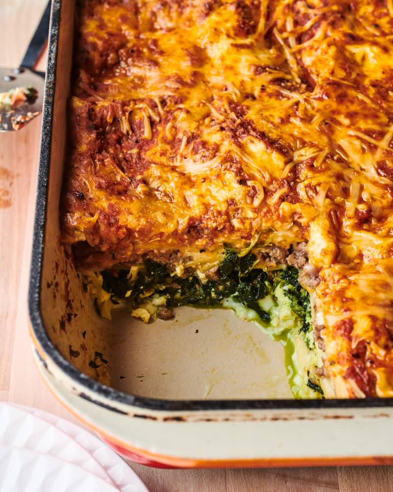 Giada de Laurentiis' classic Italian lasagna in baking dish with slice served out.