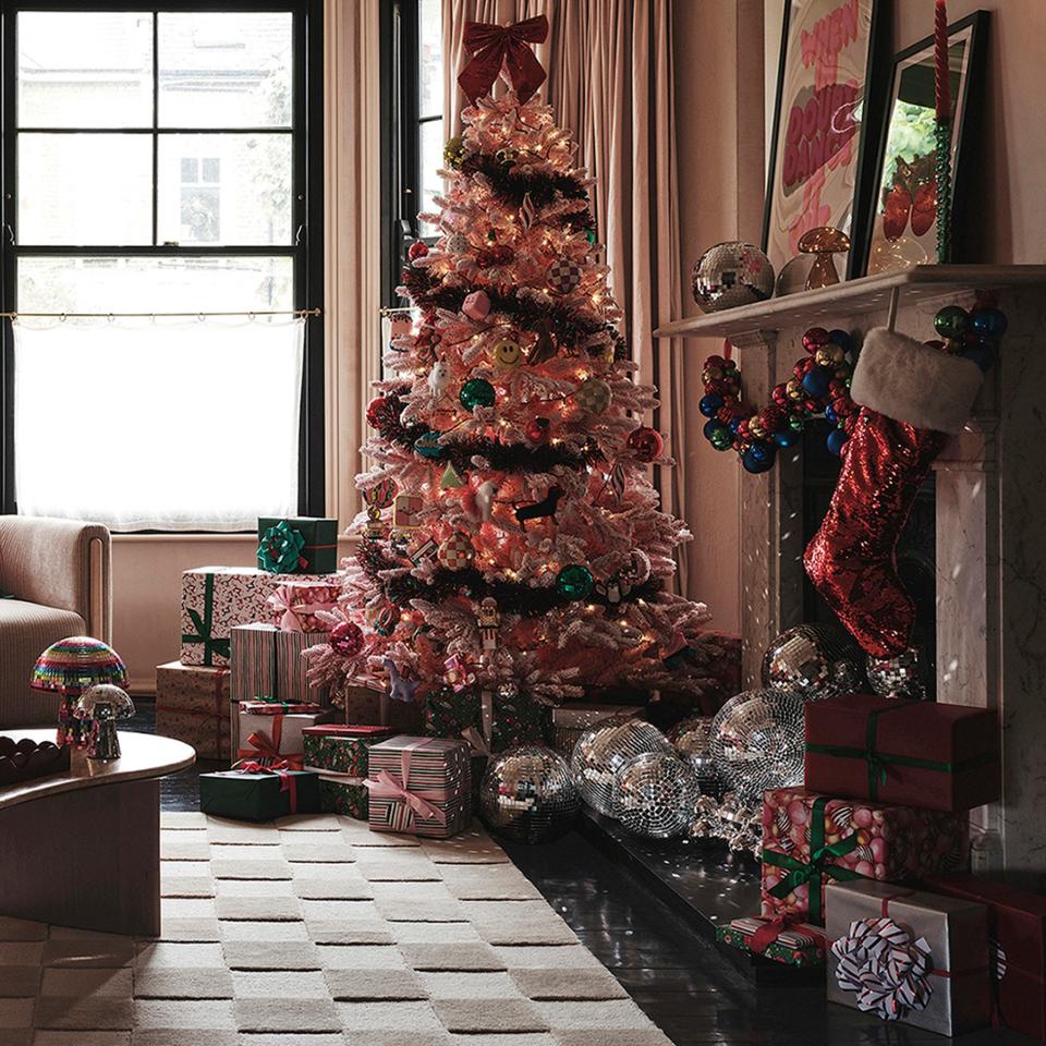 A pink Christmas tree from the John Lewis Sugar & Spice range in a living room