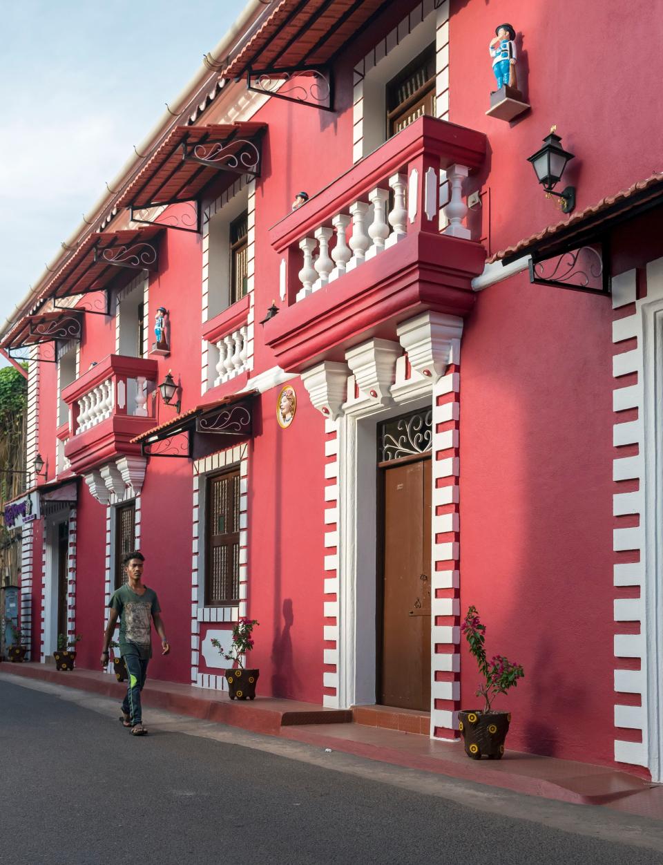 Fontainhas, the Latin Quarter of Panji, India, showcases the influence of Portuguese colonizers on the area. Brightly-colored, Portuguese-style houses sit along the cobblestone streets, and many showcase blue-and-white-tile street markers.