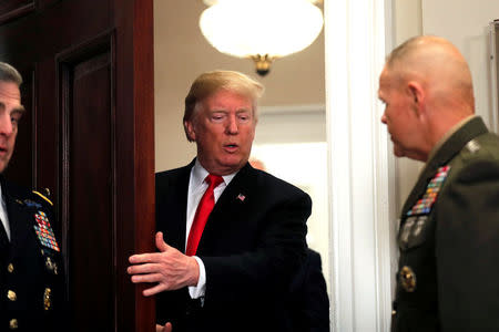 U.S. President Donald Trump arrives at the signing ceremony for the National Defense Authorization Act for Fiscal Year 2018 at the White House in Washington D.C., U.S. December 12, 2017. REUTERS/Carlos Barria