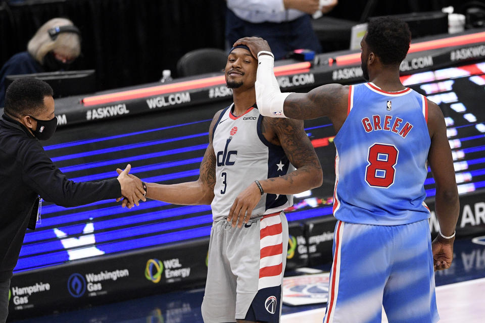 Brooklyn Nets forward Jeff Green (8) and Washington Wizards guard Bradley Beal (3) react after an NBA basketball game, Sunday, Jan. 31, 2021, in Washington. (AP Photo/Nick Wass)