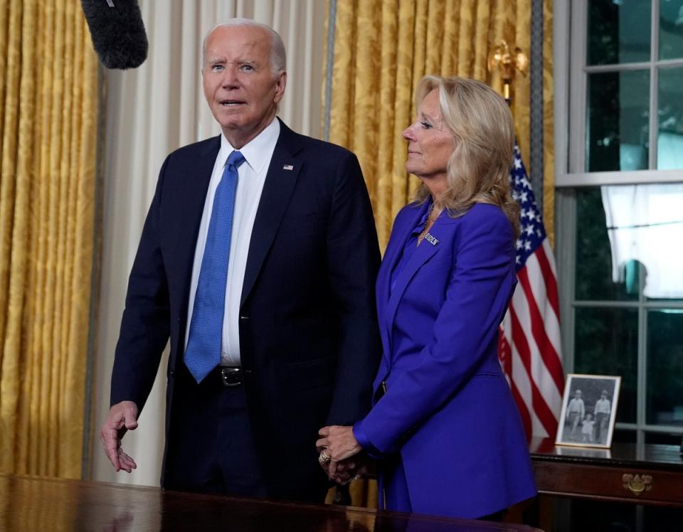 A picture of President Joe Biden’s children when they were young was perched on the table behind him (Getty Images)