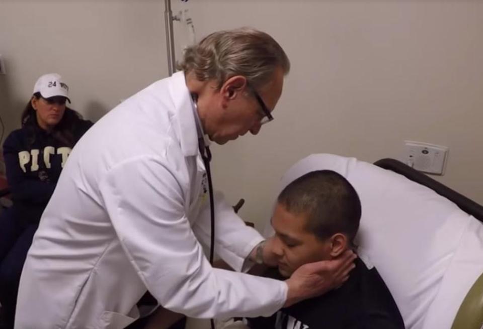 James Conner, who battled cancer, receives treatment from Dr. Stanley Marks. (Photo courtesy of UPMC and University of Pittsburgh) 