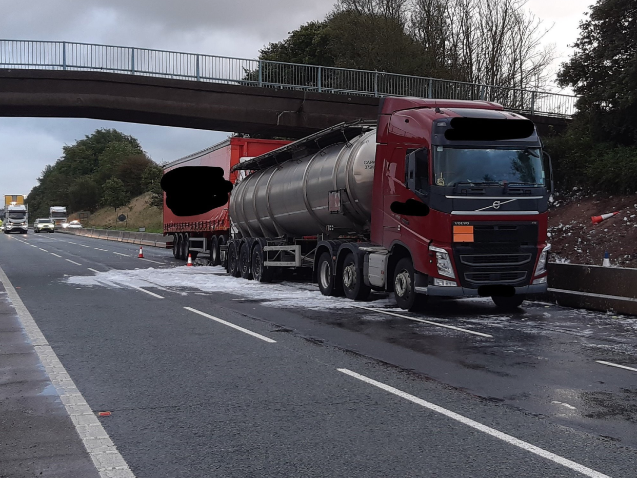 Motorists were left queuing for 11 hours after a tanker spilled 32,000 litres of gin across a busy motorway.