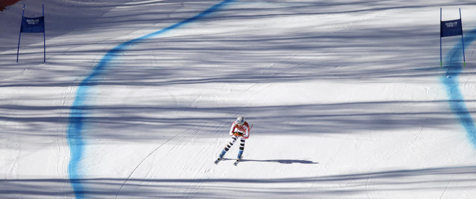 Germany's Maria Hoefl-Riesch approaches the finish area in a women's downhill training run for the Sochi 2014 Winter Olympics, Friday, Feb. 7, 2014, in Krasnaya Polyana, Russia. (AP Photo/Gero Breloer)