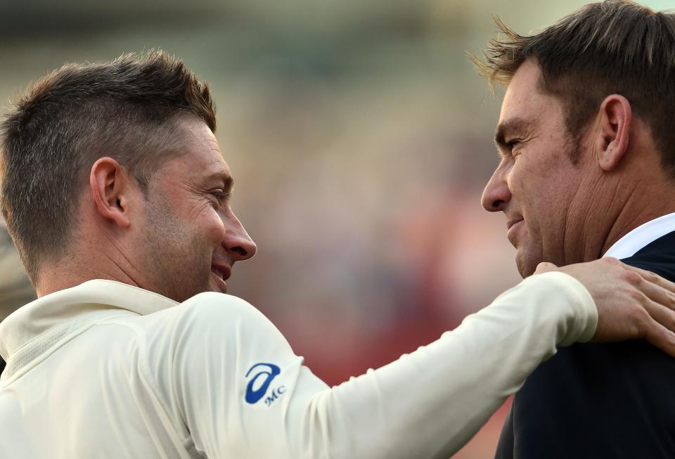 Fomer Australian captain Michael Clarke (pictured left) embraces and talks with former spin legend Shane Warne (pictured right).