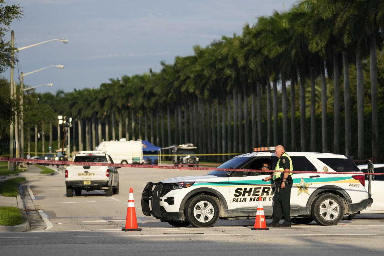 Police block off a road.