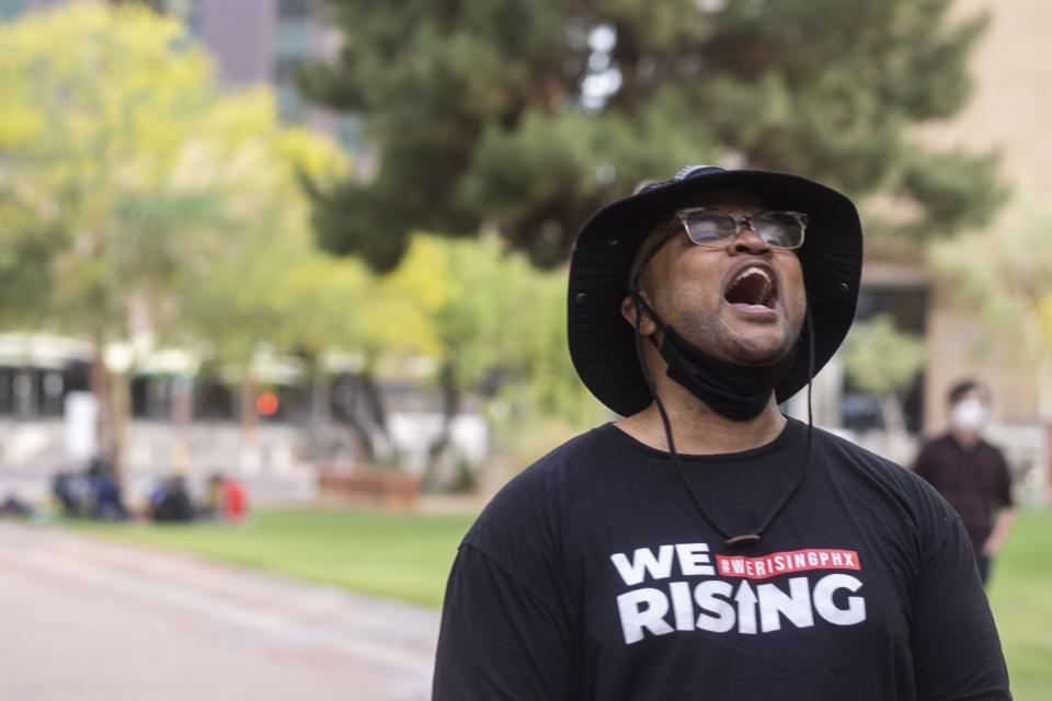 Jacob Raiford speaks to the crowd at the rally against police brutality at Cesar Chavez Plaza at Phoenix City Hall on Washington Street in downtown Phoenix on April 15, 2021.