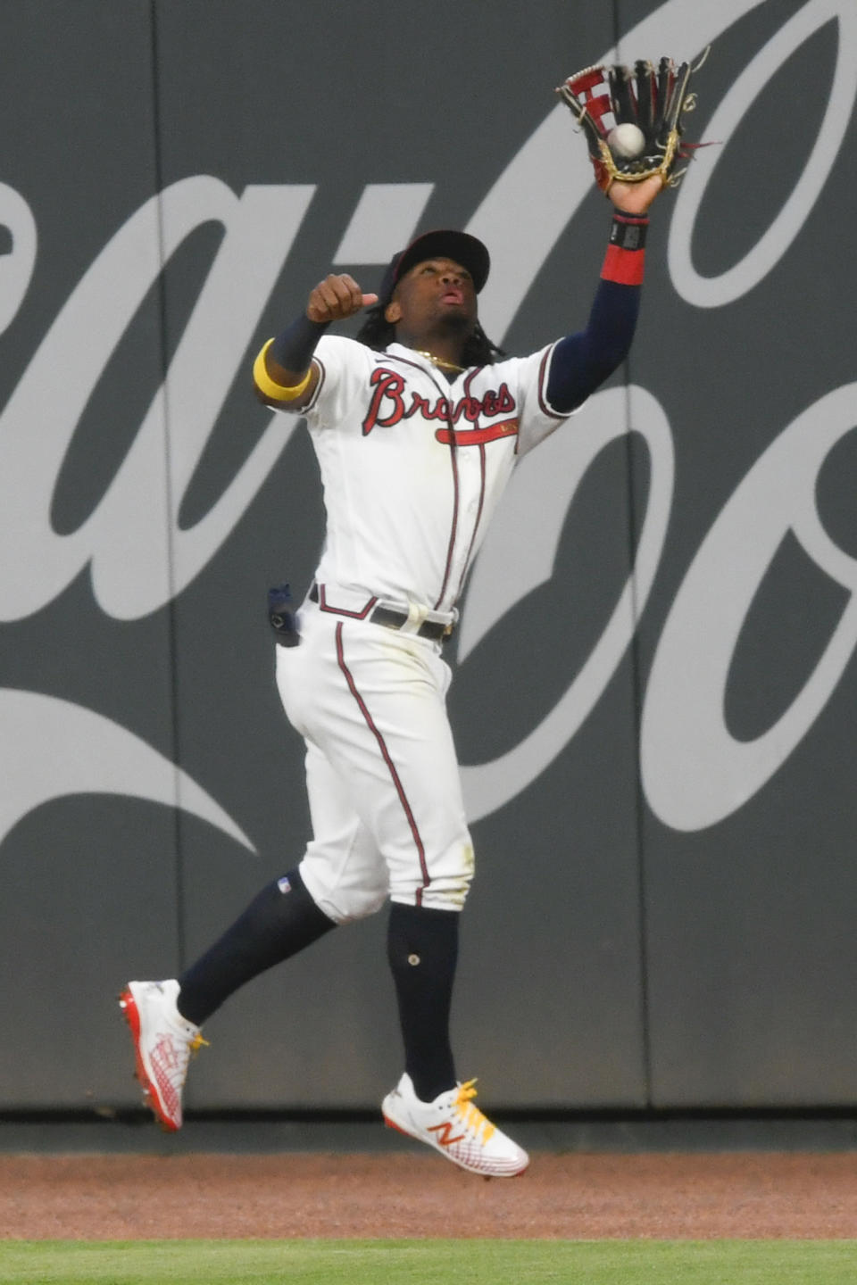 Atlanta Braves right fielder Ronald Acuna Jr. catches a fly ball off the bat of Miami Marlins' Brian Anderson to end a baseball game in the ninth inning, Monday, Sept. 21, 2020, in Atlanta. (AP Photo/John Amis)