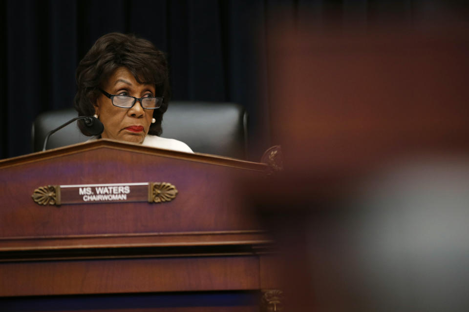 FILE - In this April 10, 2019, file photo, House Financial Services Committee chairwoman Maxine Waters, D-Calif., listens during a hearing with leaders of major banks on Capitol Hill in Washington. After nearly three decades in Waters has become the highest-ranking African American woman in the country. (AP Photo/Patrick Semansky, File)