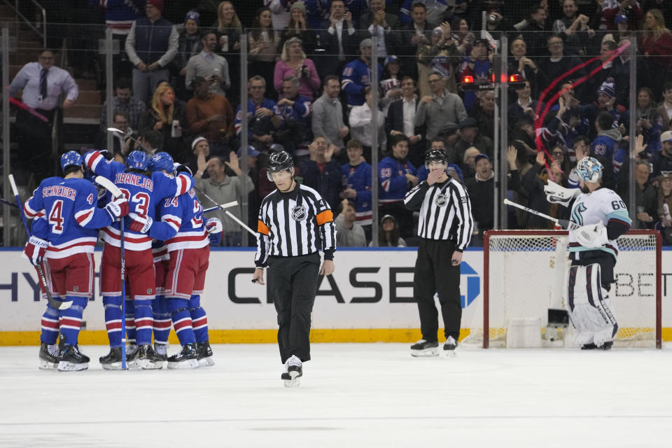 Seattle Kraken goaltender Chris Driedger (60) reacts as the New York Rangers celebrate a goal by defenseman Erik Gustafsson during the first period of an NHL hockey game, Tuesday, Jan. 16, 2024, at Madison Square Garden in New York. (AP Photo/Mary Altaffer)