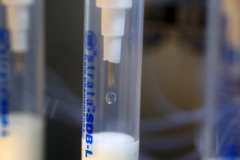 ORANGE COUNTY, CA-OCTOBER 9, 2019: A machine is rinsed that runs samples to test for PFAS compounds at the Orange County Water District on October 9, 2019 in Orange County, California. Officials will release new water quality results this week that will show widespread contamination of PFAS, a toxic chemical linked to cancer. (Photo By Dania Maxwell / Los Angeles Times)