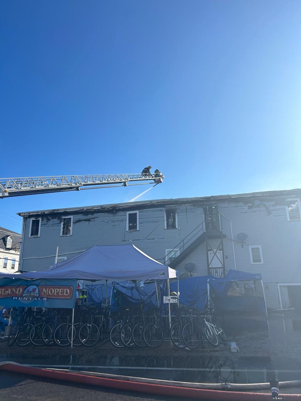 Fire crews working at the Harborside in in New Shoreham on Block Island where a massive fire broke out Friday night. Power is out on the island and visitors are asked to not travel to the island Saturday.