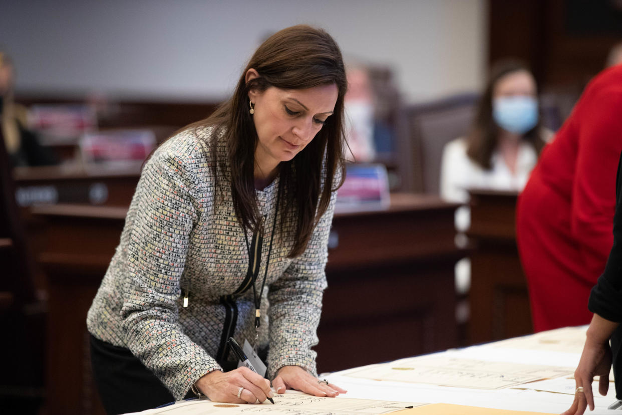 Lt. Gov. Jeanette Nuñez signs the certificates of vote during a meeting of the Florida Presidential Electors at the Florida Capitol in Tallahassee Monday, Dec. 14, 2020.