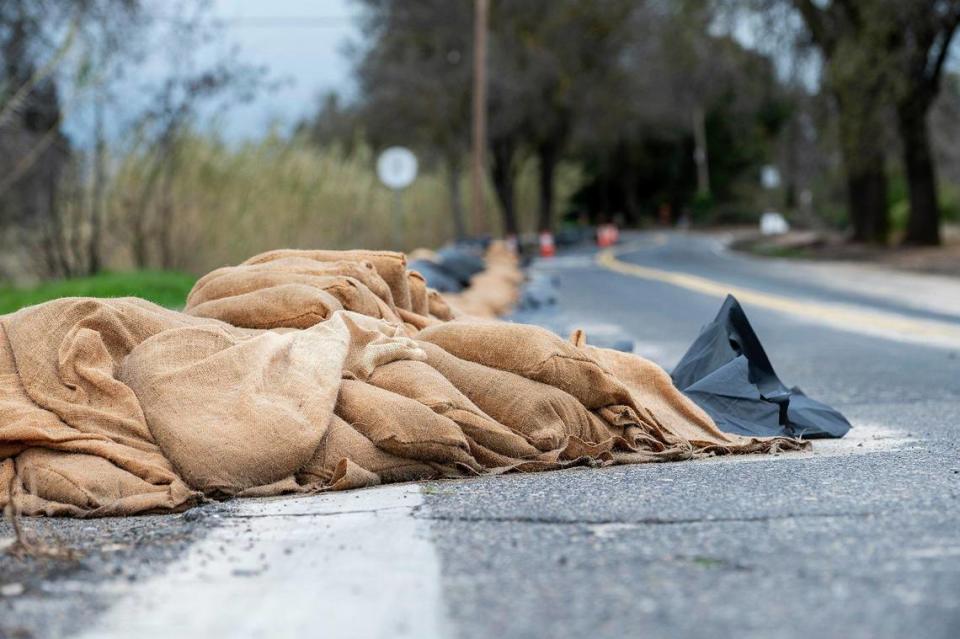 Sandbags line West North Bear Creek Drive in Merced, Calif., on Tuesday, March 14, 2023.