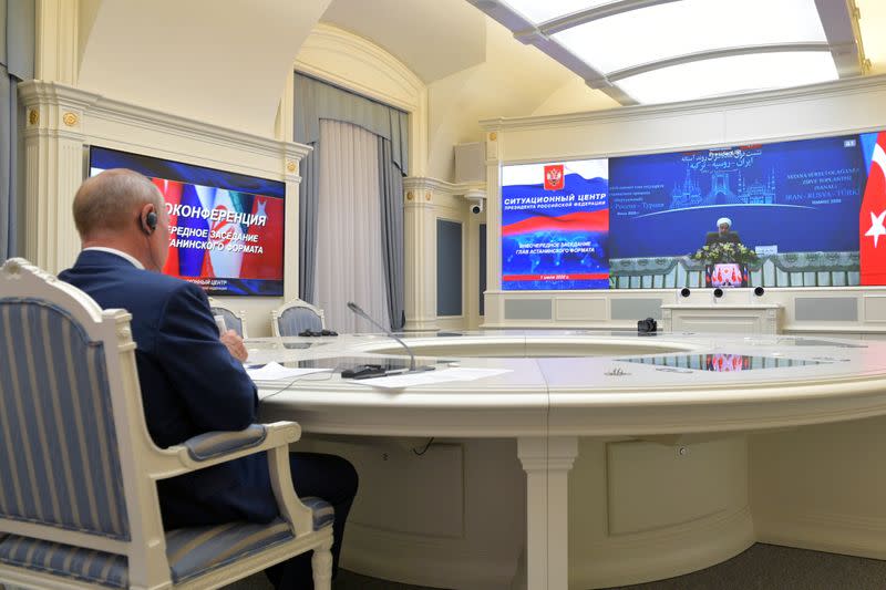 Russia's President Putin speaks with Turkey's President Erdogan and Iran's President Rouhani during a video conference call in Moscow