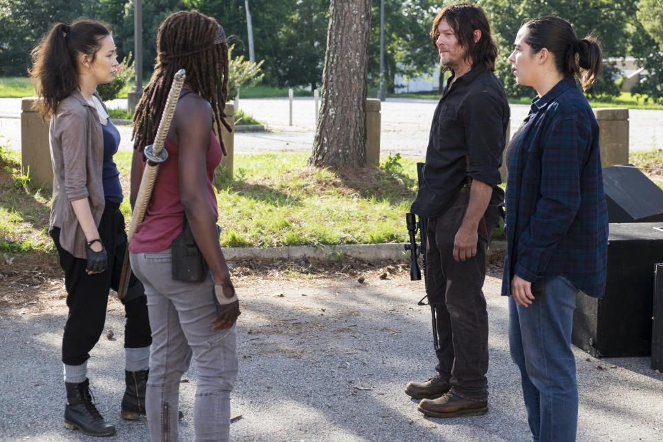 Norman Reedus as Daryl Dixon, Alanna Masterson as Tara Chambler, Christian Serratos as Rosita Espinosa, and Danai Gurira as Michonne in <em>The Walking Dead</em> (Photo Credit: Gene Page/AMC)